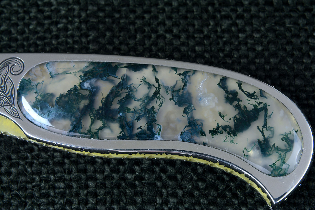 "Izar" liner lock folding knife, obverse side view in 440C high chromium stainless steel blade, hand-engraved 304 stainless steel liners, 6AL4V anodized titanium lockplate, handle inalys of Indian Green Moss Agate gemstone