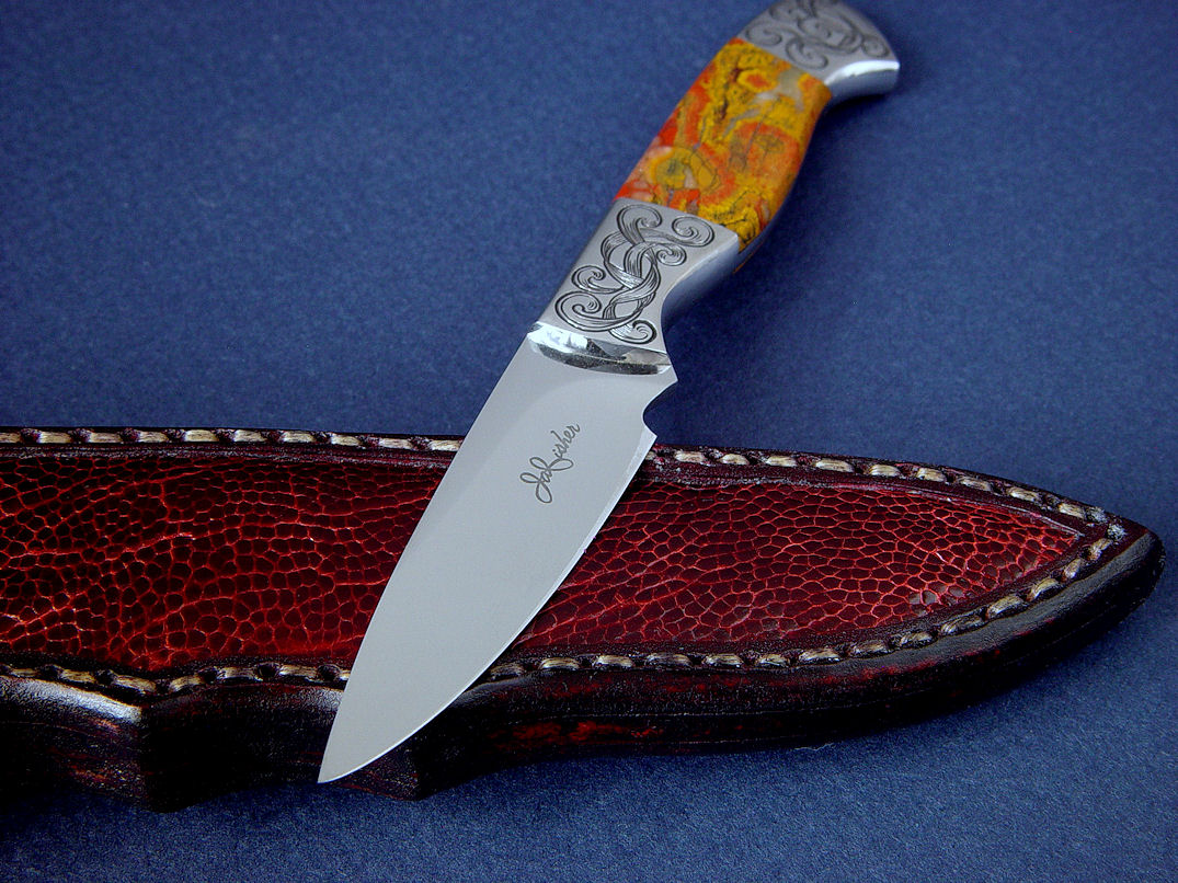 "Nekkar" obverse side view in 440C high chromium stainless steel blade, hand-engraved 304 stainless steel bolsters, Morgan Hill Poppy Jasper gemstone handle, Ostrich leg skin inlaid in hand-carved leather sheath