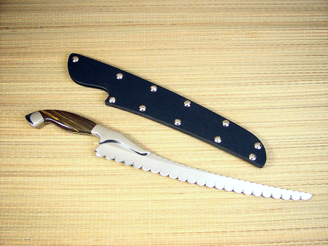 "Sasserides" Chef's bread knife, reverse side view in 440C high chromium stainless steel blade, 304 stainless steel bolsters, Australian Tiger Iron gemstone handle, kydex, nickel plated steel slip sheath