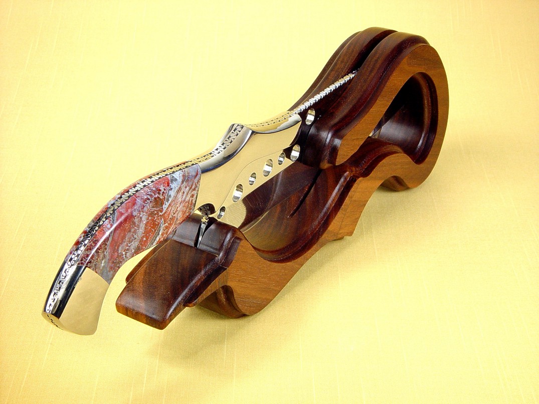 "Saussure" Master Chef's Knife in working, display stand. American Black Walnut is contoured, hand-finished in oils an waxes for a natural look. 