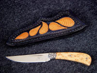 Hand-engraved low carbon steel bolster with Pecan burl hardwood knife handle