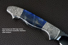 "Carina" reverse side view in mirror polished and hot-blued O1 high carbon tungsten-vanadium tool steel blade, hand-engraved 304 stainless steel bolsters, Labradorite gemstone handle, hand-carved, hand-dyed leather sheath