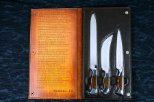 "Bordeaux, Courbe Vaste, Thresher" fine handmade chef's knives, BBQ knives, obverse side view in T3 cyrogenically treated 440C high chromium stainless steel blades, 304 stainless steel bolsters, Caprock petrified wood gemstone handles, Bison (American Buffalo), leather shoulder book case