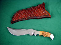 "Flamesteed" tactical survival knife, obverse side view: 440C high chromium stainless steel blade, 304 stainless steel bolsters, Olive Burl hardwood handle, hand-tooled leather sheath