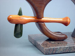 "Manaya" petaloid celt mount detail. Nephrite jade and tulipwood hardwood in walnut and red oak mounted on granite