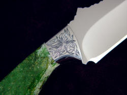 "Mercator" reverse side front bolster engraving detail. Design is like seaweed fronds, interlocking and flowing, blending well with intense green jade gemstone