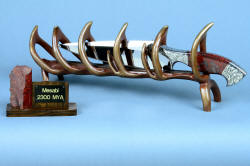 "Mesabi" custom knife sculpture in hand-cast bronze, 440C high chromium stainless steel blade, 304 hand-engraved stainless steel bolsters, Fossilized Stromatolite Chert gemstone