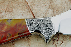 "Nunavut" 4 power enlargement of reverse side engraving on 304 high nickel, high chromium stainless steel bolster