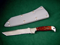 "PJLT" obverse side view in bead blasted 440C high chromium stainless steel blade, 304 stainless steel bolsters, Stabilized Laminate Phenolic (Dymondwood) handle, gray kydex, aluminum, stainless steel sheath