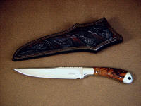 "Sanchez" boning, utility knife, obverse side view in ATS-34 high molybdenum stainless steel blade, 304 stainless steel bolsters, Desert Ironwood hardwood  handle, hand carved and tooled leather sheath