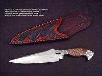 "Malaka" obverse side view: 440C high chromium stainless steel blade, hand-engraved 304 stainless steel bolsters, Cabernet Jasper gemstone handle, black stingray skin inlaid in hand-carved leather sheath